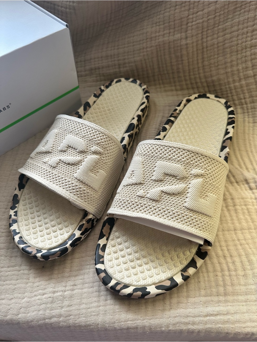 Athletic Propulsion Labs (APL) TechLoom Slide sandals in the Parchment/Leopard